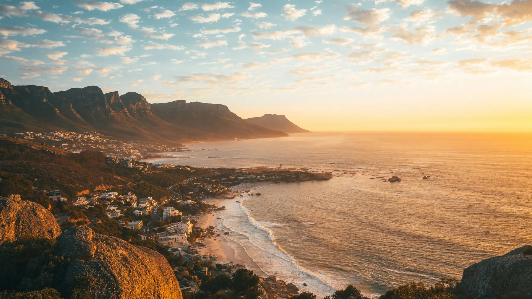 Golden-hour light along the Twelve Apostles and the Camps Bay coastline, Cape Town.